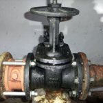 Cast iron wafer check valve in the water meter assembly