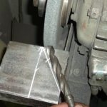 Manual sharpening of drill bits for metal